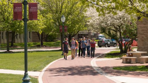 group of students walking on campus